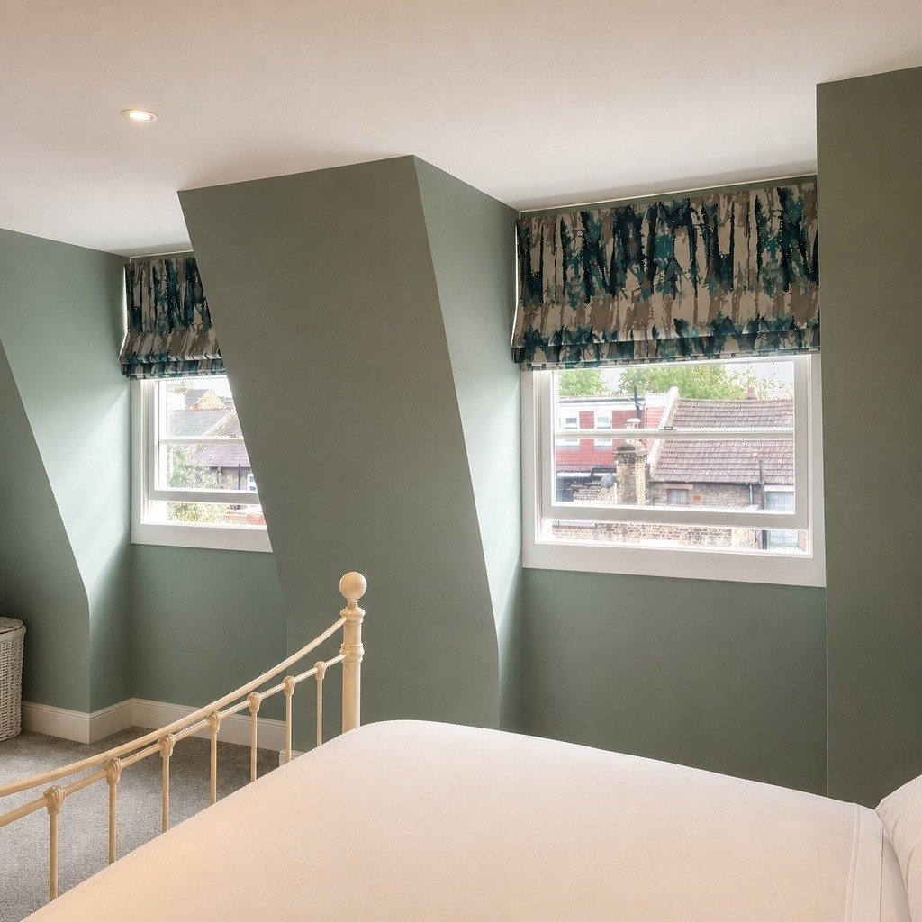 Roman blind in a green bedroom