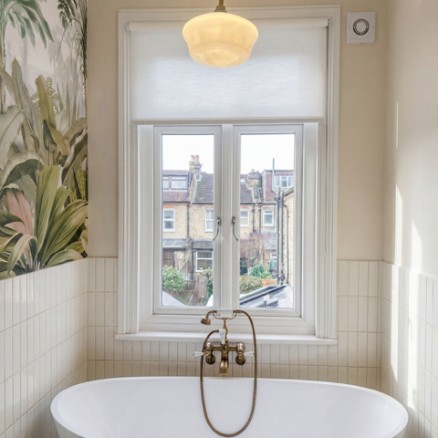Bathroom shutters above a bath